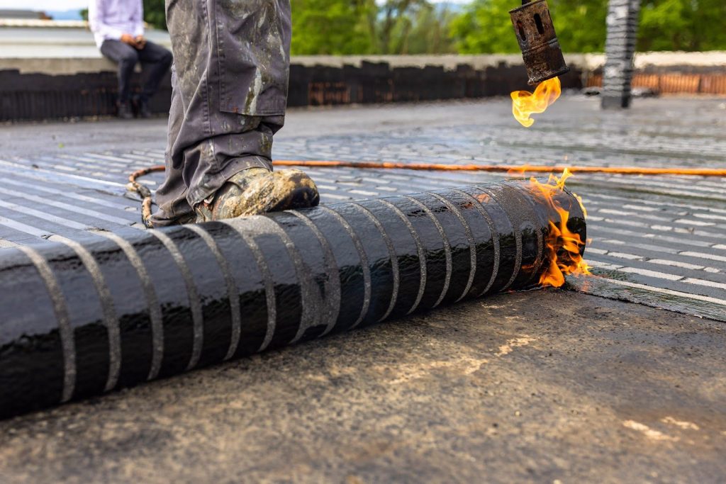 Roof repair on a flat roof membrane in Singapore